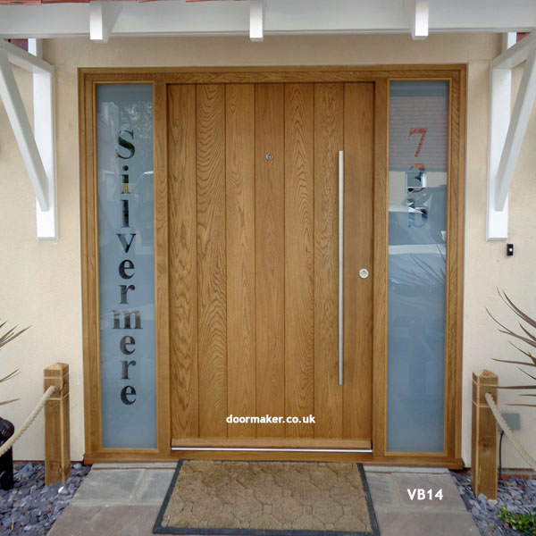 contemporary oak vertical boarded door and frame with sidelights